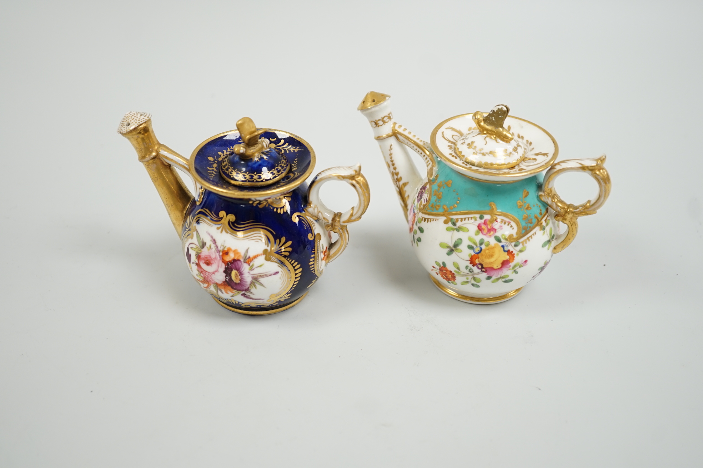 Toy porcelain. Two English rosewater sprinklers, c.1820, possibly Coalport, each modelled in the form of a watering can, tallest 9cm high